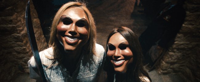 Psychotic celebrants prepare to attack the Sandin family in “The Purge.”   Universal Pictures/MCT