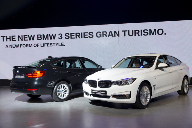 BMW’s new 320d Gran Turismo (left) and the Luxury line.   BMW Korea
