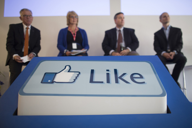 A Facebook “Like” button sits on display in front of visitors during a news conference inside Facebook Inc.’s new data storage center near the Arctic Circle in Lulea, Sweden, Wednesday.   Bloomberg