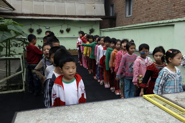Students at Tongxin Experimental Primary School line up during morning call on the outskirts of Beijing.
AP-Yonhap News