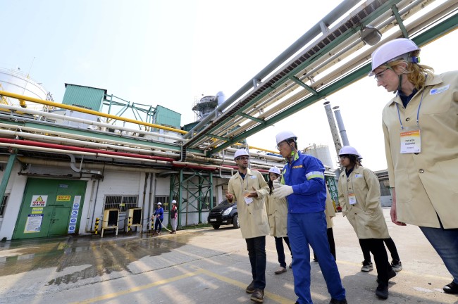 A worker at Rhodia Silica Korea guides visitors at its factory in Incheon.  Park Hae-mook/The Korea Herald