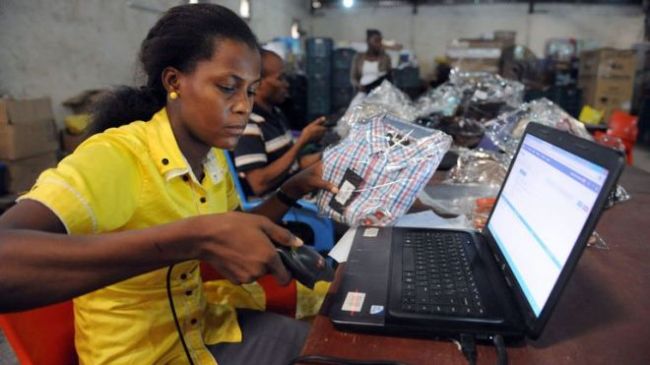 A worker at Internet company Jumia scans a product in Lagos, Nigeria.   AFP-Yonhap News