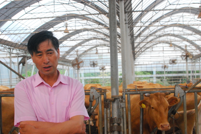 Hwang In-sik speaks during an interview with The Korea Herald at his cattle farm in Beopwon-ri, Gyeonggi Province, Friday.   Elaine Ramirez/The Korea Herald