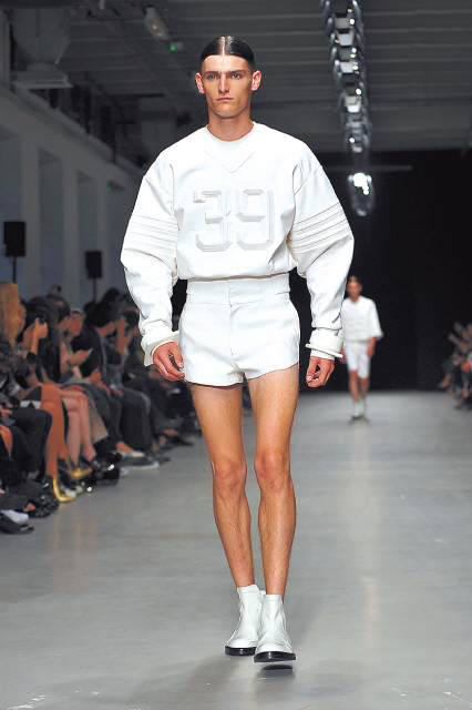 A model wears a creation by Juun.J during the designer’s fashion show on June 28 in Paris as part of the 2014 spring-summer Paris Fashion Week.