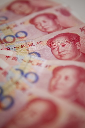 100-yuan banknotes are arranged for a photo in Beijing.   Bloomberg