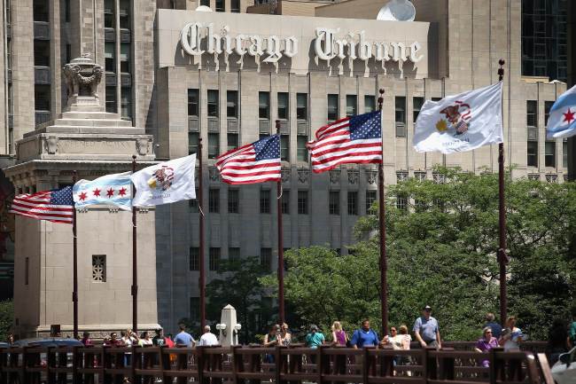 Flags fly along the Chicago Tribune Tower in Chicago, Illinois, Wednesday.   AFP-Yonhap News