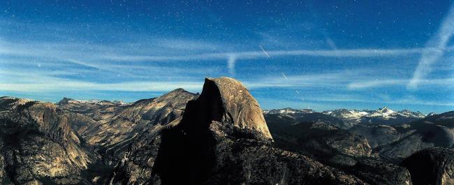 Lit by a very bright half moon, night becomes day during this 30-second time exposure view of the stars and aircraft in the skies over Half Dome at 9:35 p.m. from a Glacier Point vantage point in Yosemite National Park, May 20. (Los Angeles Times/MCT)
