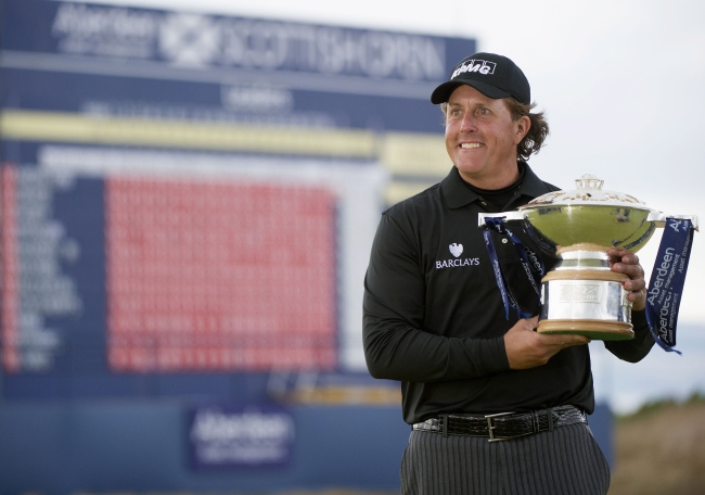 Phil Mickelson poses with the trophy at Castle Stuart Golf Course in Inverness, Scotland, Sunday.   AP-Yonhap News