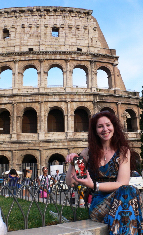 A model poses holding LG Optimus G Pro with the Colosseum as the backdrop in Rome, Italy.   LGE