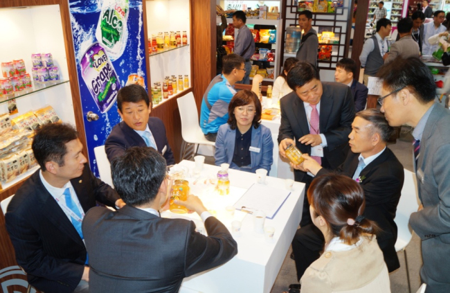 Taekwan officials discuss distribution with Chinese partners during the SIAL CHINA 2013 food expo in Shanghai in May.   Taekwan