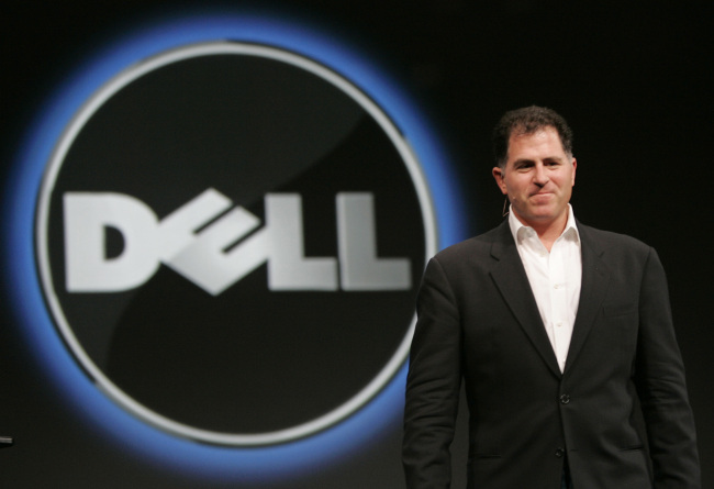 Dell CEO Michael Dell stands by the company logo at a conference in San Francisco on Nov. 14, 2007.   AP-Yonhap News
