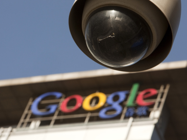 A security camera is mounted near the Google Inc. China headquarters in Beijing.   Bloomberg