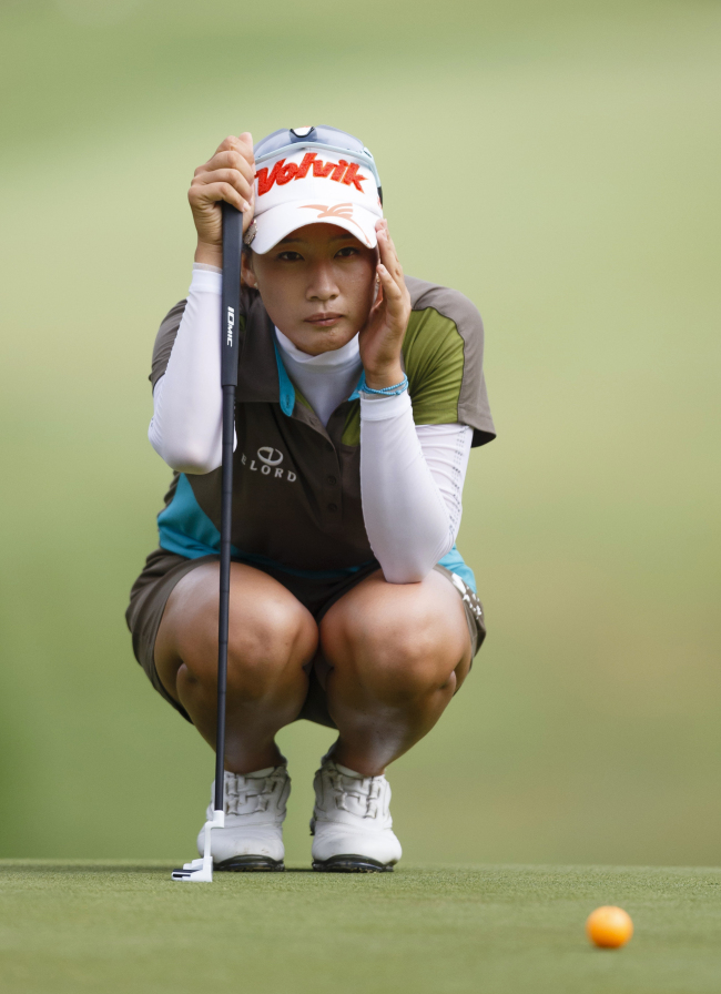 Korea’s Chella Choi lines up her putt on the first green on Saturday.   AP-Yonhap News