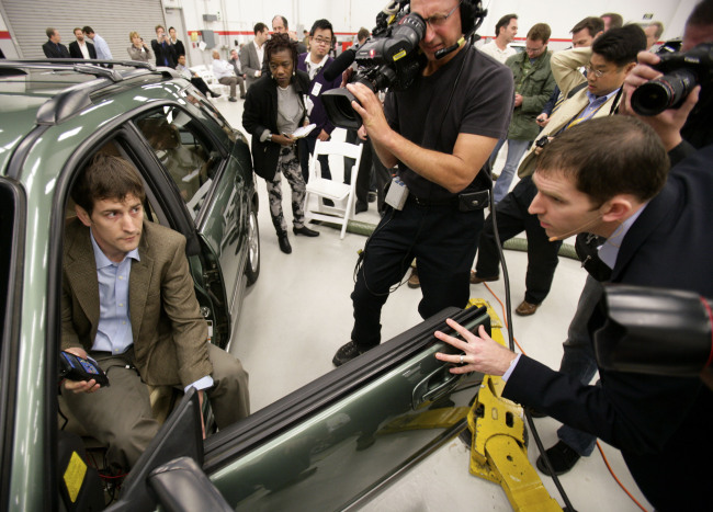 Matthew Schwall (right), managing engineer of Exponent Inc., an engineering firm hired by Toyota Motor Corp. to investigate sudden-acceleration complaints, checks with a colleague performing a test at Toyota’s U.S. sales headquarters in Torrance, California, in March 2010.   Bloomberg