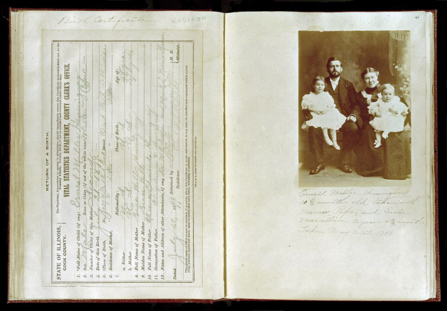 This photo provided July 17, 2013, by the John F. Kennedy Presidential Library shows the birth certificate and family photograph of Ernest Hemingway from a scrapbook created by his mother, Grace Hall Hemingway, at the John F. Kennedy Presidential Library in Boston. (AP)