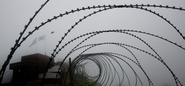A South Korean guard post is seen behind a barbed wire fence in the Demilitarized Zone. (Yonhap News)