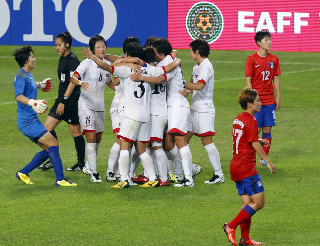 North Korean players rejoice after winning a football match against South Korea at the Women's East Asian Cup tournament at Seoul World Cup Stadium on Sunday. (Yonhap News)