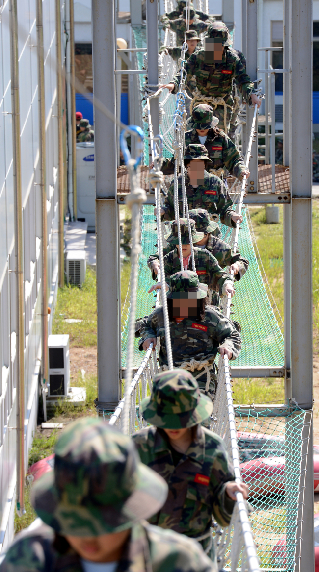 Students particiapte in a private marine camp in Taean County on the west coast.   Korea Herald file photo