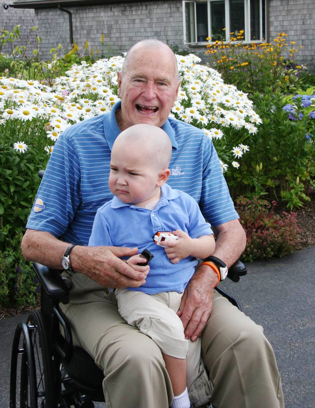 This photo shows former President George H. W. Bush with Patrick (last name withheld at family’s request) in Kennebunkport, Maine.   AP-Yonhap News