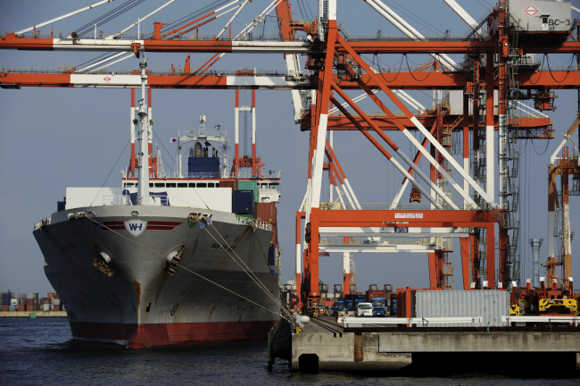 A Wan Hai Lines Ltd. container ship sits moored at a shipping terminal in Yokohama, Kanagawa prefecture, Japan, Saturday.   Bloomberg