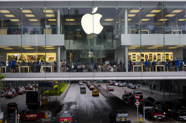 Customers shop at an Apple Inc. store in Hong Kong on July 16.   Bloomberg