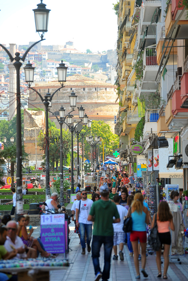 Pedestrians walk along a busy shopping street in Thessaloniki, Greece, on Saturday, July 27, 2013. As unemployment hits a record, the Greek parliament adopted last week the final piece of a plan to put 4,200 state employees on notice for dismissal before euro partners signed off on this month's 2.5 billion-euro payment. Photographer: Oliver Bunic/Bloomberg
Pedestrians walk along a busy shopping street in Thessaloniki, Greece.    Bloomberg
Pedestrians walk along a busy shopping street in Thessaloniki, Greece.    Bloomberg