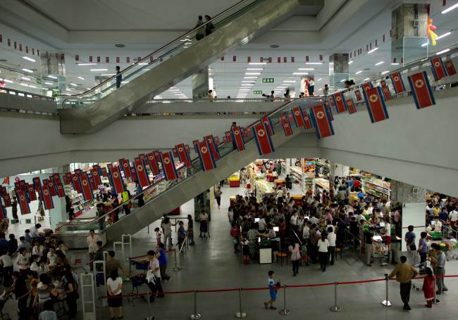 Customers shop at a supermarket in Pyongyang.   AFP-Yonhap News