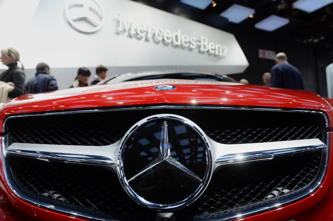 The grill of a Daimler AG Mercedes-Benz E-Class Coupe vehicle is seen during the 2013 North American International Auto Show in Detroit. 	Bloomberg
