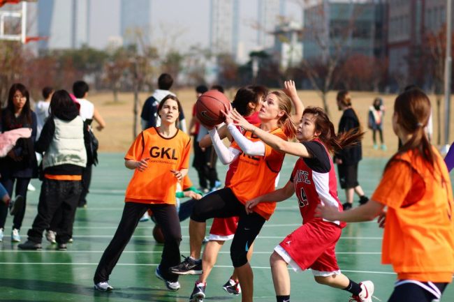 Students compete in women’s basketball at the 2012 International Students Sports and Cultural Festival in September 2012.   KISSA