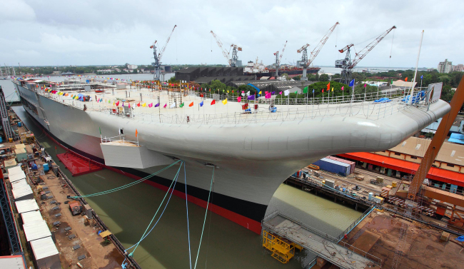 India’s indigenous aircraft carrier INS Vikrant, built by the Cochin Shipyard Limited for the Indian navy, is docked at the Cochin Shipyard Limited in Kerala, India, Sunday.   Xinhua-Yonhap News