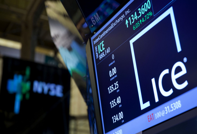 InterContinentalExchange Inc. signage and stock information are displayed on an electronic monitor on the floor of the New York Stock Exchange in New York.    Bloomberg