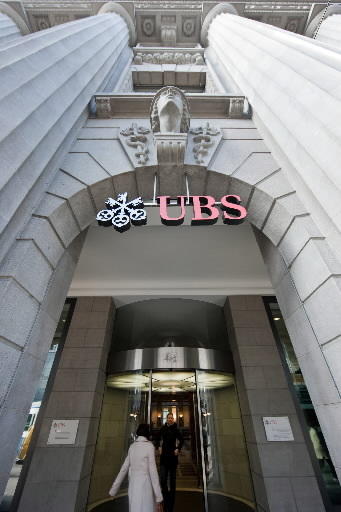 A pedestrian enters the UBS headquarters on Bahnhofstrasse in Zurich, Switzerland.   Bloomberg