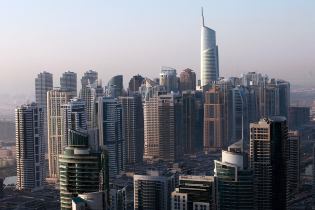 The Almas tower stands above other skyscrapers at the Jumeirah Lake Towers development in Dubai.    Bloomberg