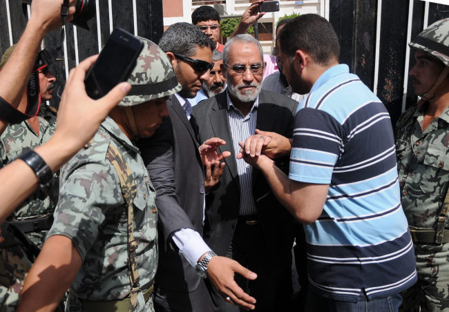 A file photo taken on May 24, 2012 shows, Gen. Guide of Egypt’s Muslim Brotherhood Mohamed Badie (center) at a polling station during the presidential election in Beni Suef, Egypt.   Xinhua-Yonhap News