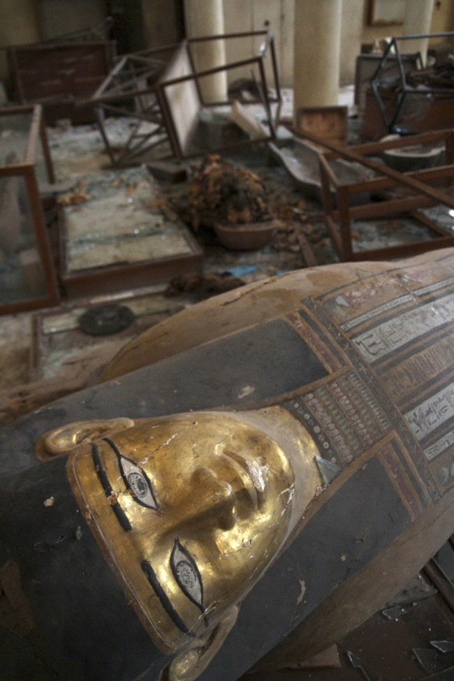In this photo taken on Aug. 17, damaged pharaonic objects lie on the floor of the Malawi Antiquities Museum after it was ransacked and looted between the evening of Aug. 15 and the morning of Aug. 16 in Malawi, Egypt. AP-Yonhap News
