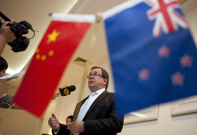 New Zealand Foreign Minister Murray McCully speaks to a journalist during a group interview in Beijing on Thursday.    AP-Yonhap News