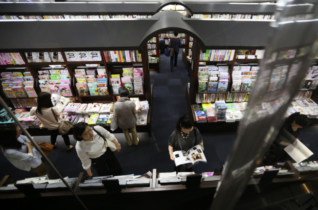 Customers browse in a bookstore in the Ginza district of Tokyo.   Bloomberg