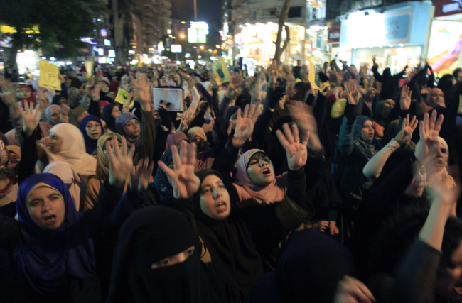 Supporters of Egypt’s ousted President Mohammed Morsi chant slogans during a protest to commemorate two months since he was ousted in Cairo on Tuesday.   AP-Yonhap News
