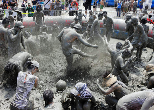 Visitors have fun at the 16th Boryeong Mud Festival in July.   Yonhap News
