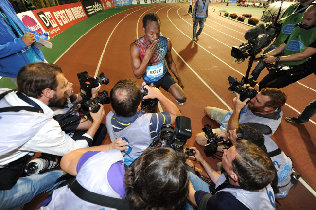 Usain Bolt celebrates his win in the men’s 100 meters.    AP-Yonhap News