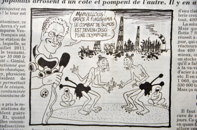 A French newspaper ran a cartoon Wednesday depicting mutant sumo wrestlers in a reference to the nuclear disaster in Fukushima, Japan.