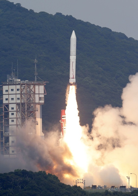 An Epsilon rocket lifts off from the Uchinoura Space Center in Kimotsuki town, Kagoshima, western Japan Saturday. Japan launched the new rocket it hopes will be a cheaper and more efficient way of sending satellites into space, following a two-week postponement.
