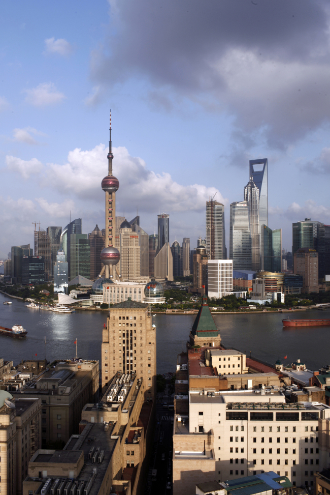 The historic Bund sits in the foreground with the Lujiazui financial district on the other side of the Huangpu river in Shanghai.   Bloomberg