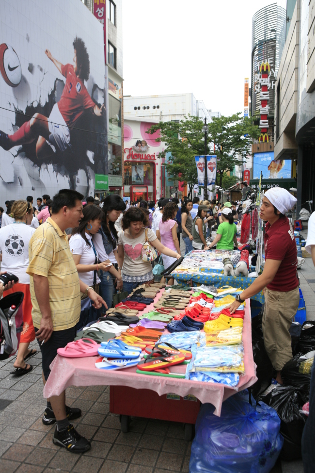 Chinese tourists shop in Myeong-dong, a popular shopping district in Seoul.    KTO