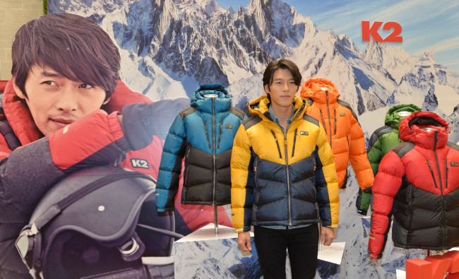 Actor Hyun Bin promotes a new down jacket by local outdoor brand K2 Korea at a launch in Seoul on Monday.   Lee Sang-sub/The Korea Herald