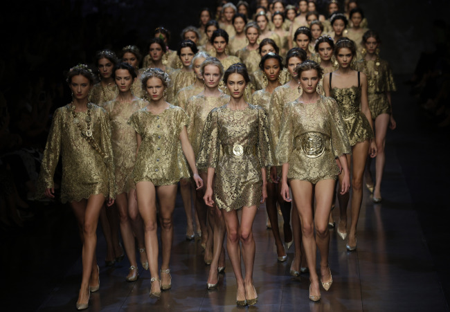 Models wear creations from Dolce & Gabbana women’s Spring-Summer 2014 collection as part of the Milan Fashion Week in Milan on Sunday.   AP-Yonhap News