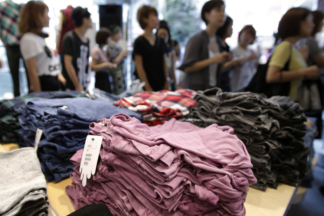 Customers enter a Monki fashion store in the Harajuku shopping district in Tokyo.   Bloomberg