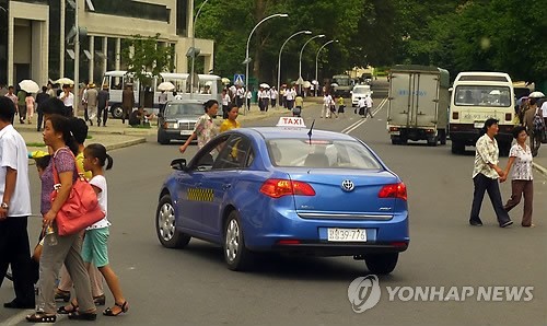 A taxi drives in downtown Pyongyang in this undated file photo.   (Yonhap News)