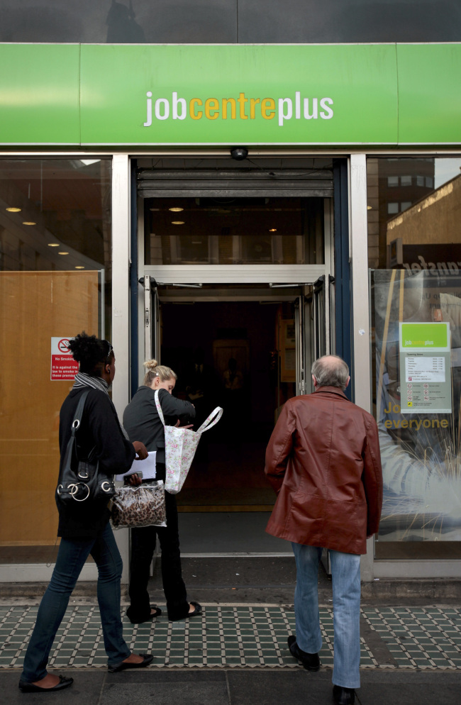 Jobseekers enter an employment center in London.    (Bloomberg)