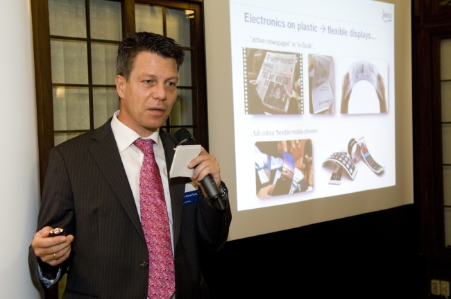 Michael Grand, CEO of Merck Korea, gives a presentation on changes brought by future display technology at a press meeting Wednesday.   (Merck)